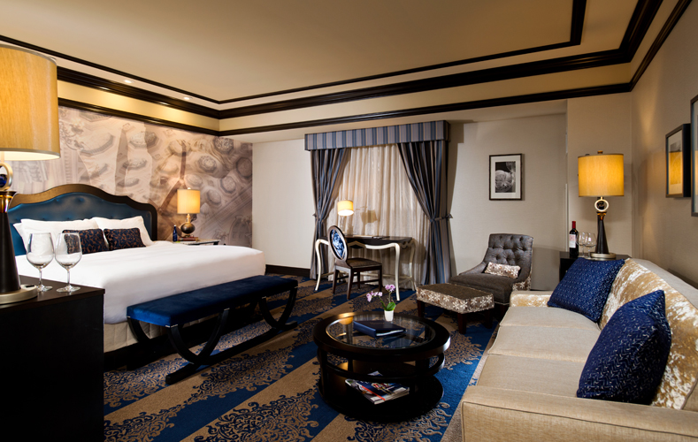 Executive King Room with king sized bed, quilted headboard, pull out sofa bed and Victorian writing table