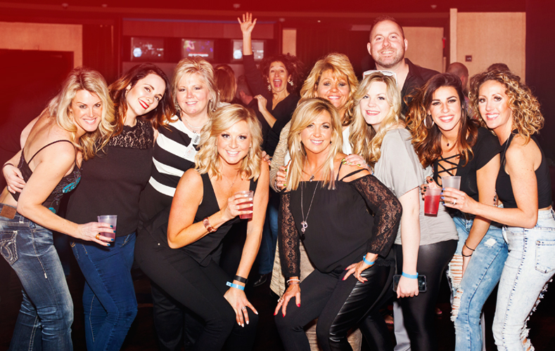 Group of guests at Vapor standing together in a lounge