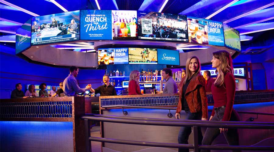 Two women entering Mane Bar at Saratoga Casino Hotel