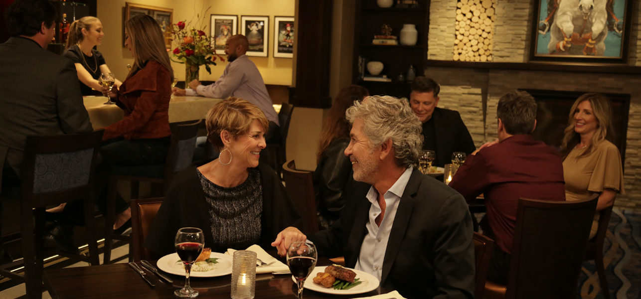 Couple dining in intimate VIP lounge